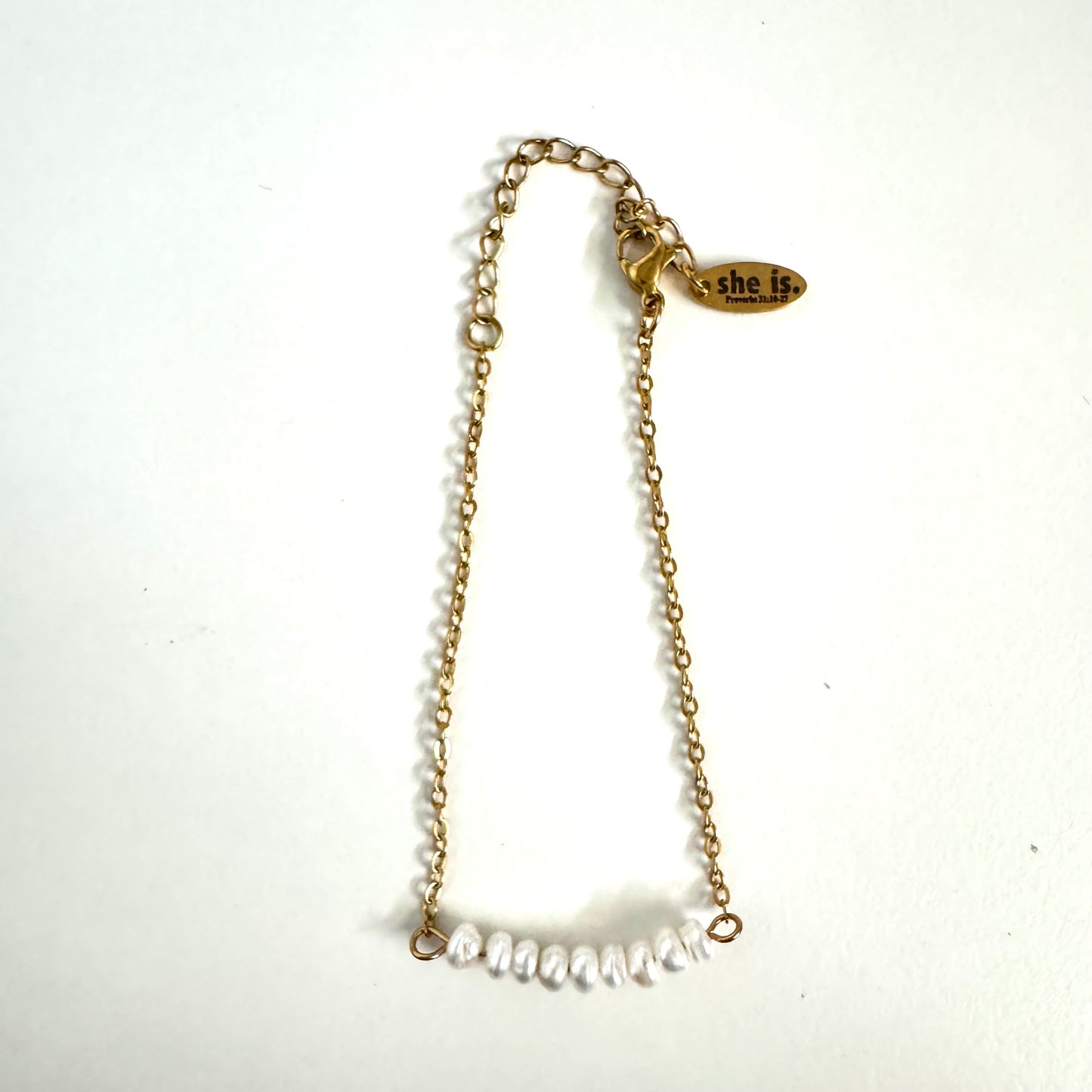 She is -dainty pearl bracelet